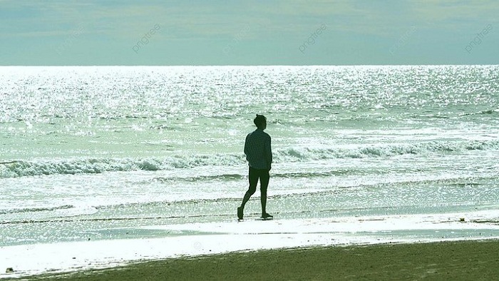 437486bc180249b3ca51da5fb870ce7b pngtree backlight real shot of a man walking on the beach image 837